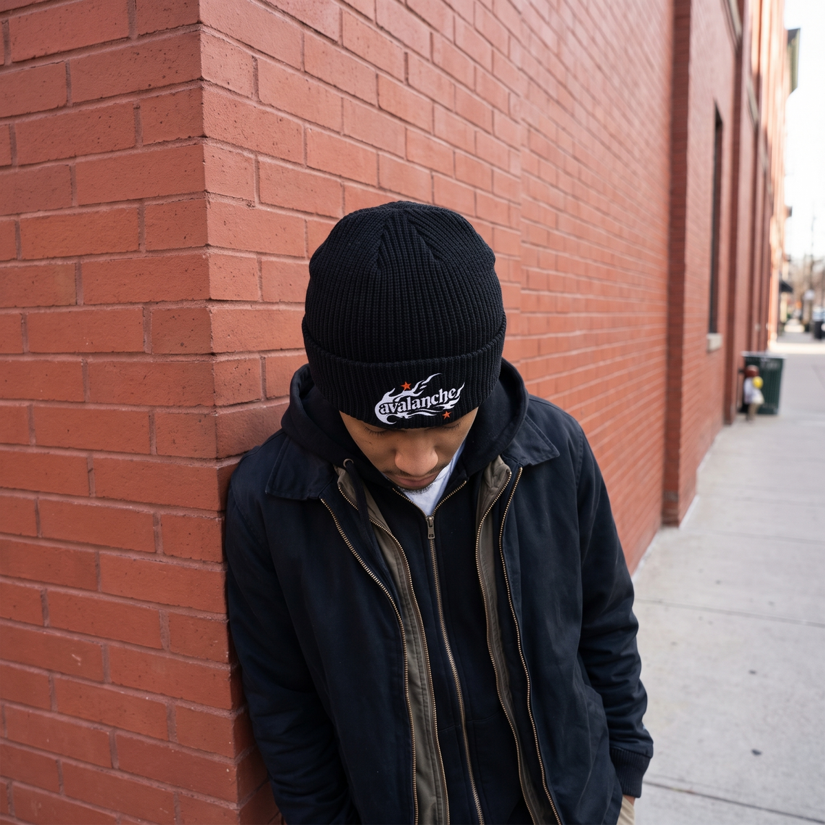 Cuff Beanie worn at a brick building corner