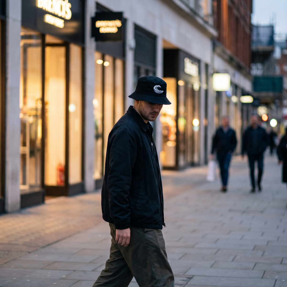 Wave Grid Bucket Hat worn on a clean city street at dusk