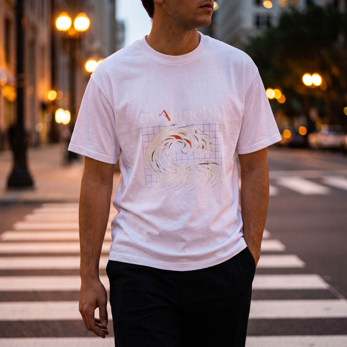 Oversized Men's Tee worn crossing a city crosswalk at dusk